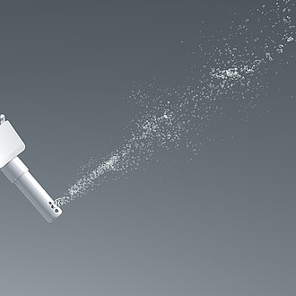 This picture shows a nozzle from which the water jet of the comfort shower comes. The water jet is wider and consists of several widely fanned drops of water. 