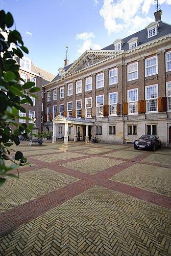 Bed in hotel suite at Sofitel Amsterdam