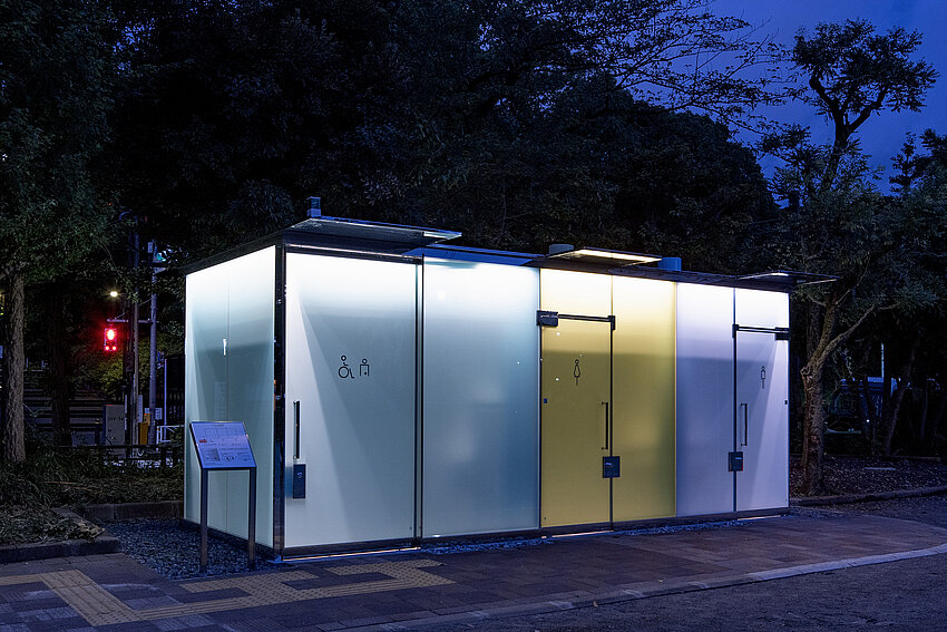 Toilet in Haruno Ogawa Community Park. The panes, of blue, yellow and purple sections are milky and opaque.