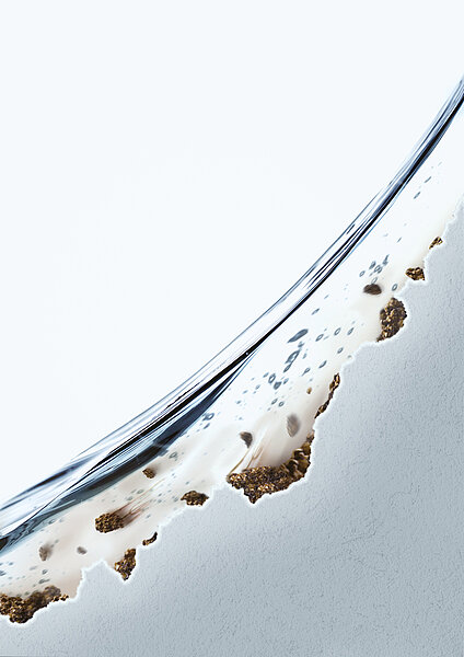 The image shows a close-up of a ceramic. The surface of the ceramic has a few areas that do not form a smooth surface, but are rough. Brown deposits are found in these areas. 