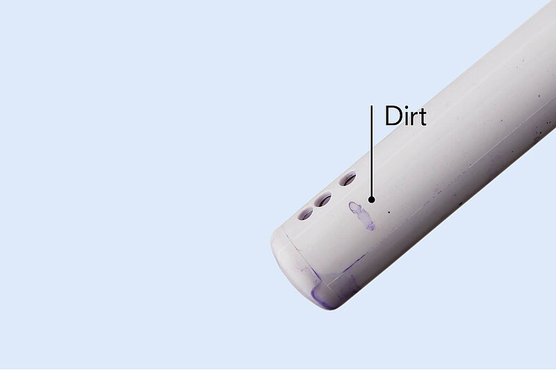 The picture shows a nozzle that has not been cleaned with EWater+. Dirt is still visible on this nozzle. 