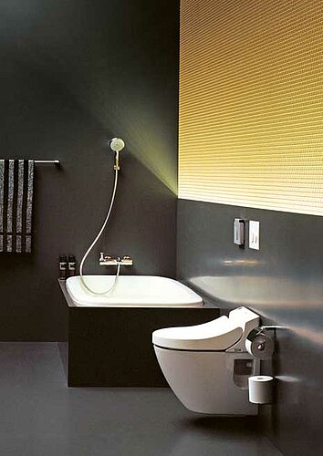 Black bathroom with WASHLET® and bathtub